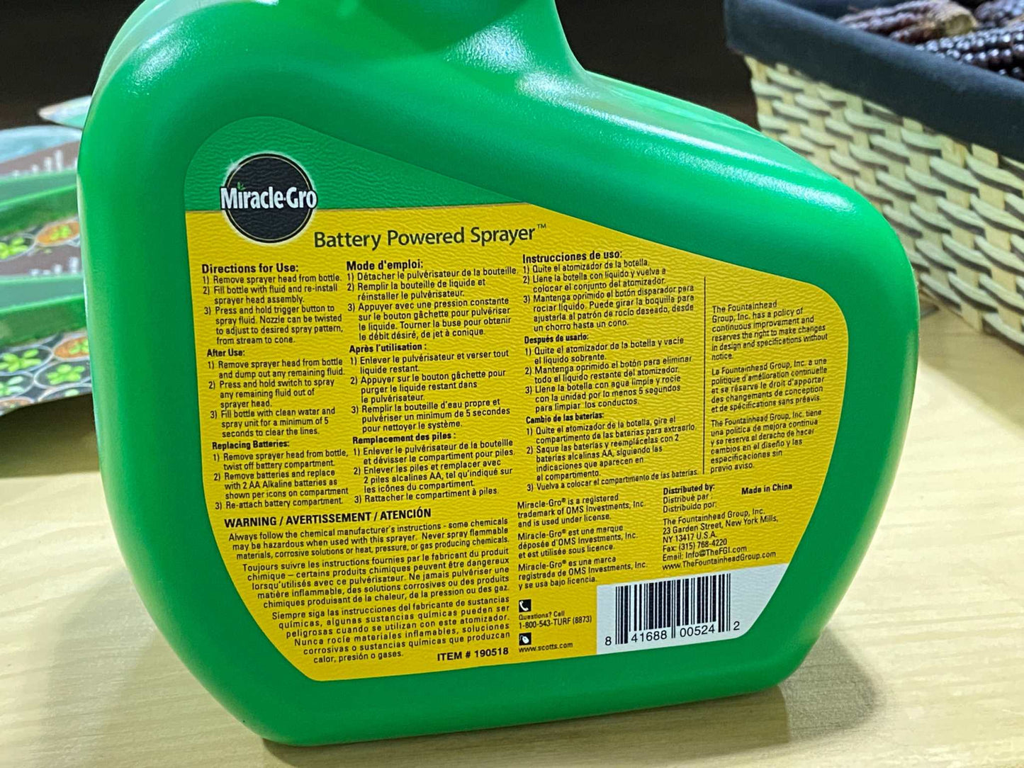 Miracle Gro Garden Sprayer, battery powered, ergonomic design, green bottle.