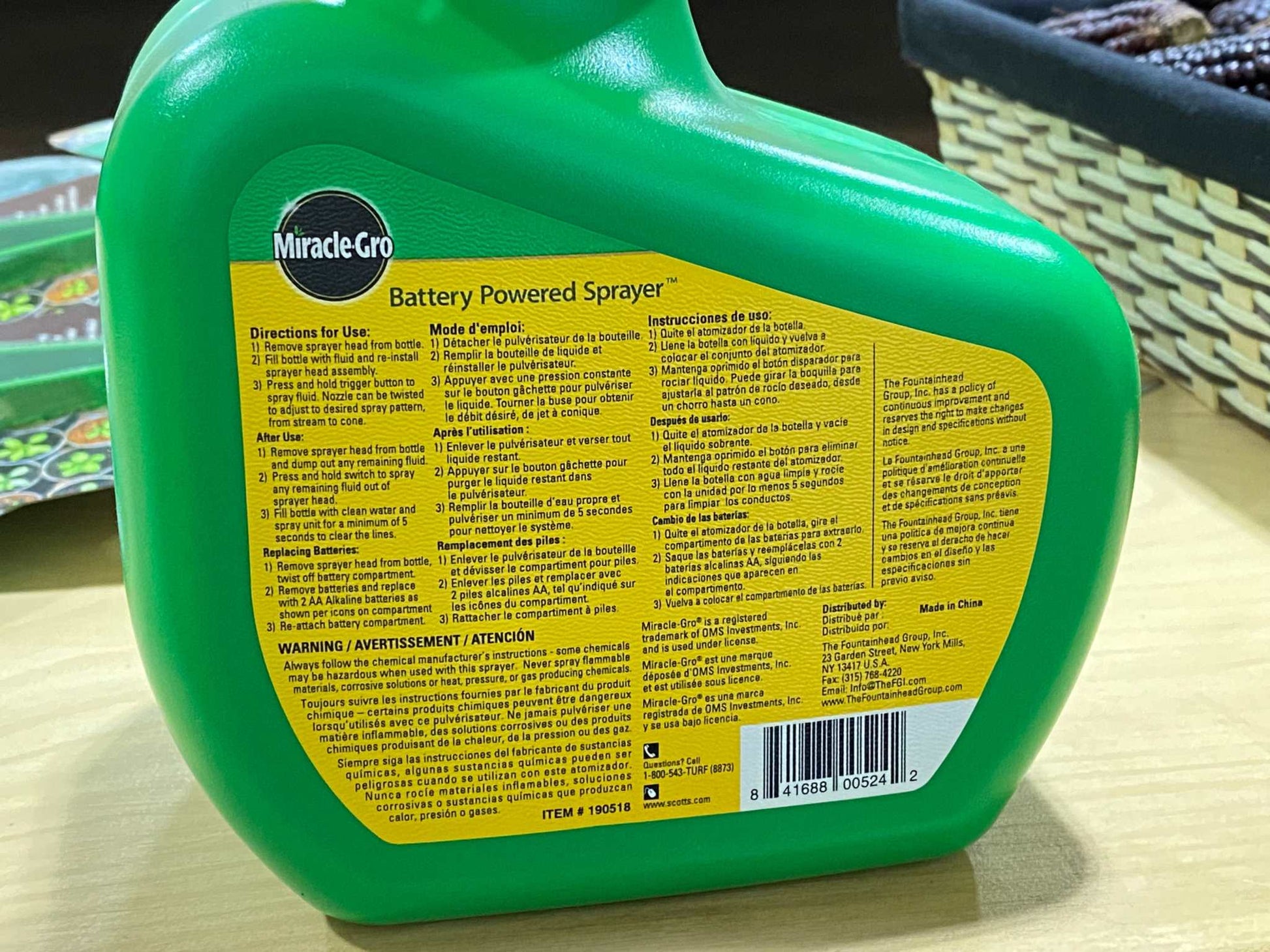 Miracle Gro Garden Sprayer, battery powered, ergonomic design, green bottle.