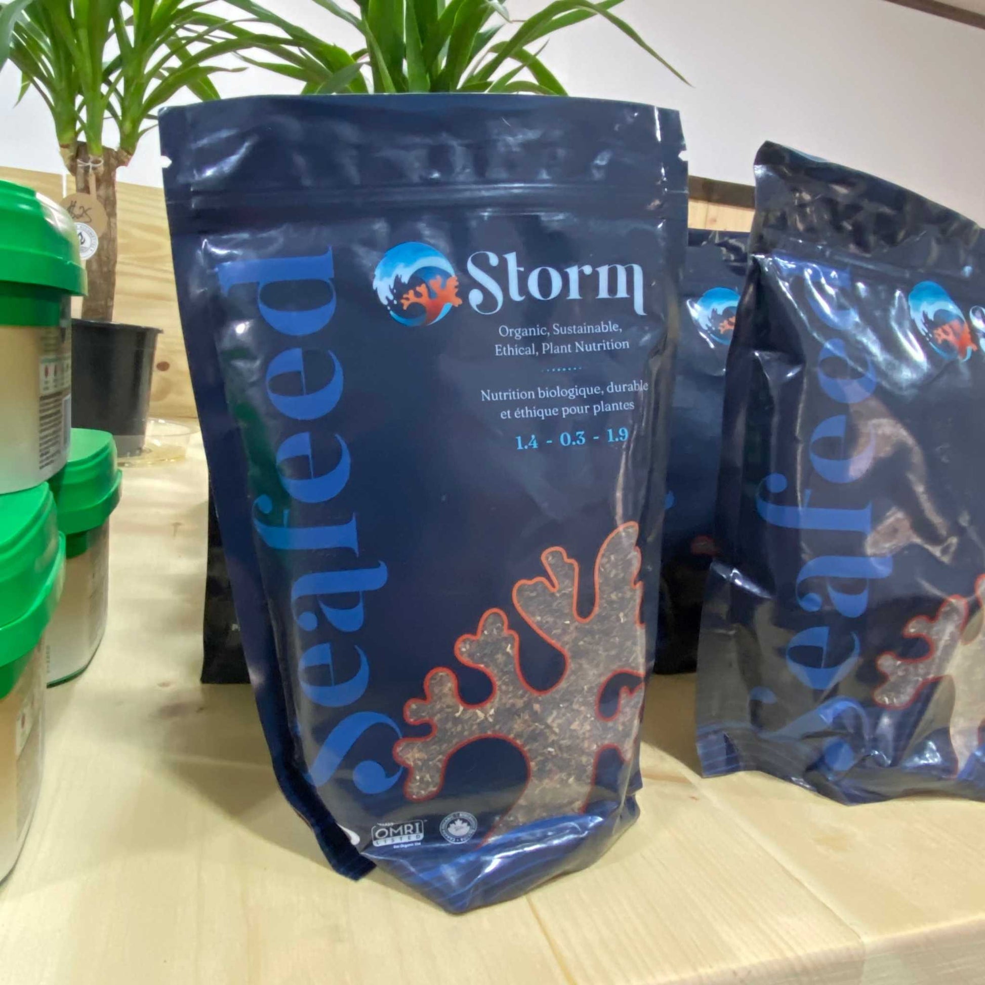 Storm Kelp Meal Organic Fertilizer packaging on display, featuring Seafeed plant formulation.