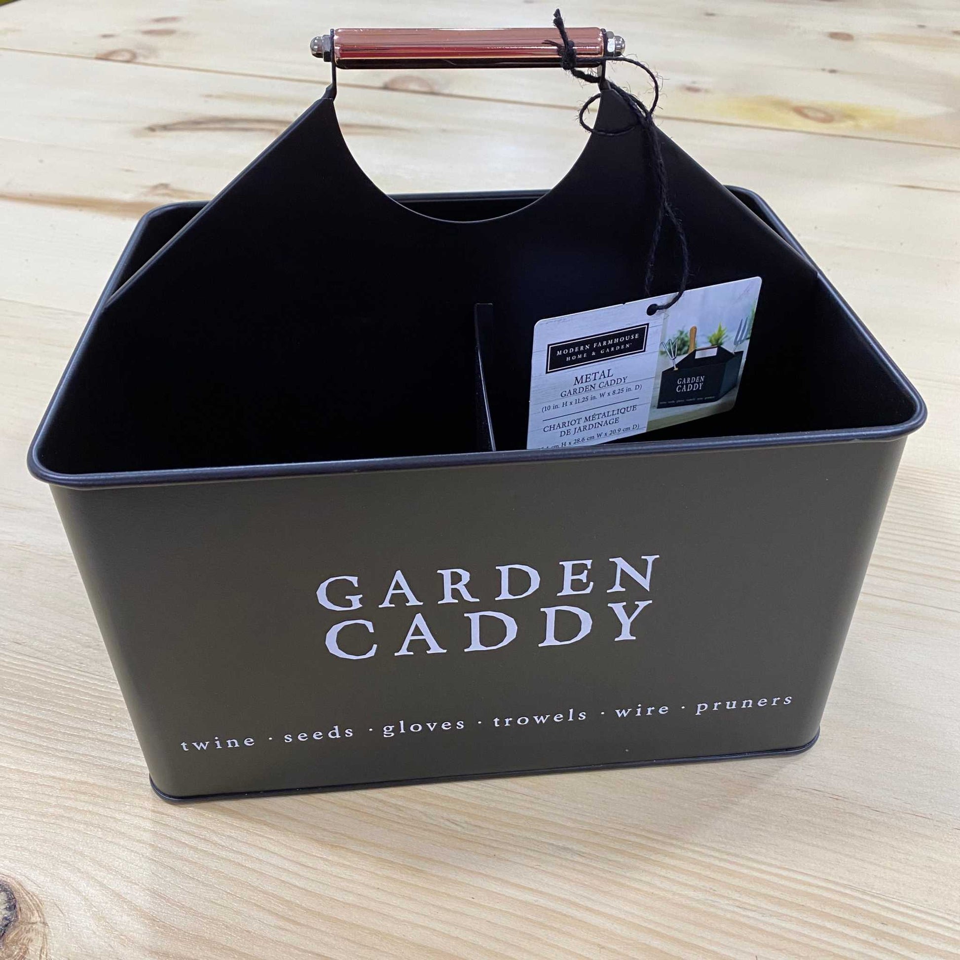 Decorative black metal garden caddy with sturdy handle and rustic charm.