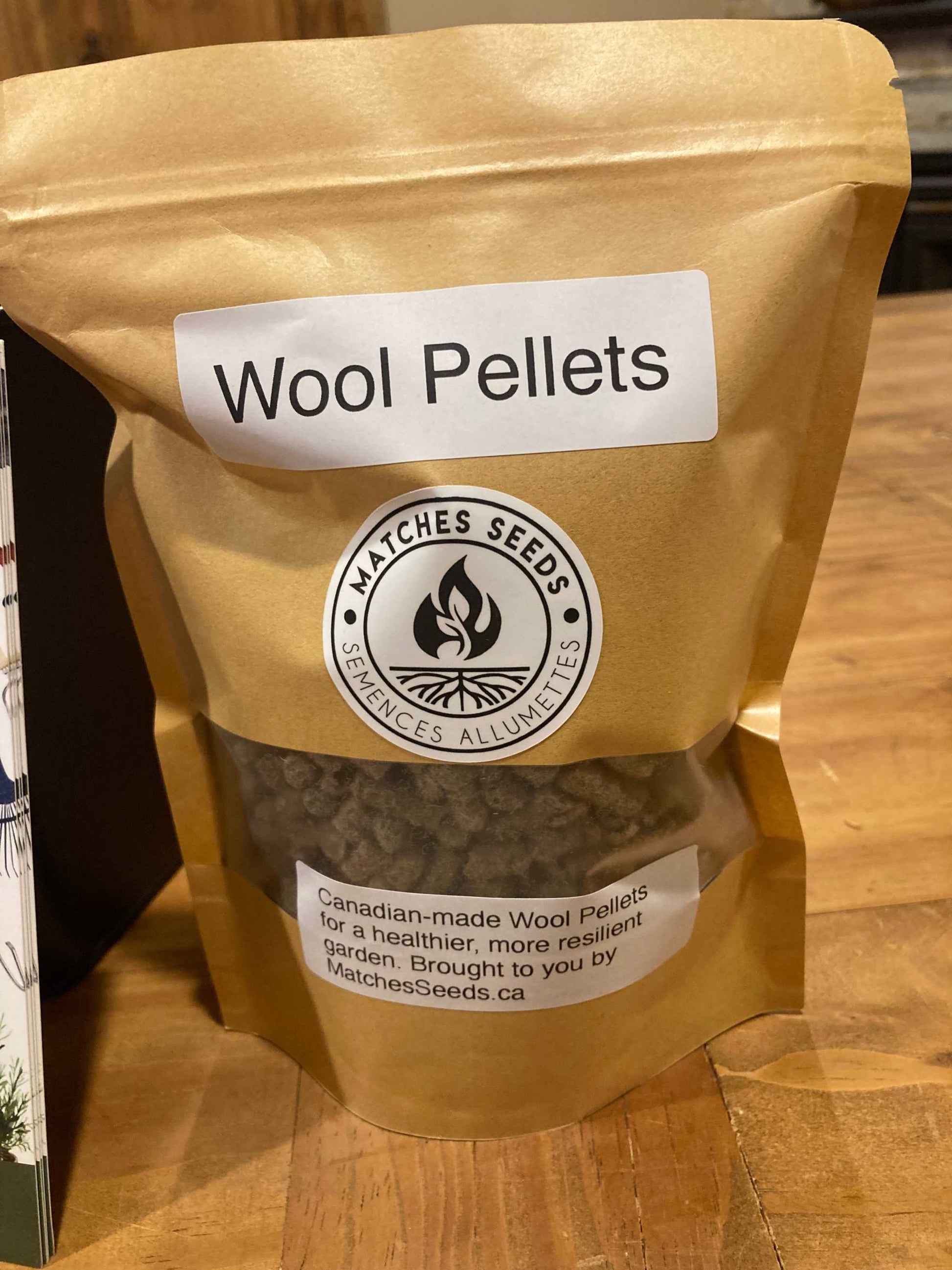 Bag of Wool Pellets with a visible brand label on a wooden surface Garden Wool Pellets MatchesSeeds Matches Seeds MatchesSeeds.ca 