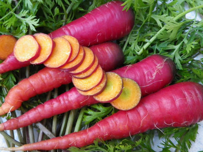 Cosmic Purple Carrot heirloom seeds with vibrant purple skin and orange centers, fresh and nutrient-rich.