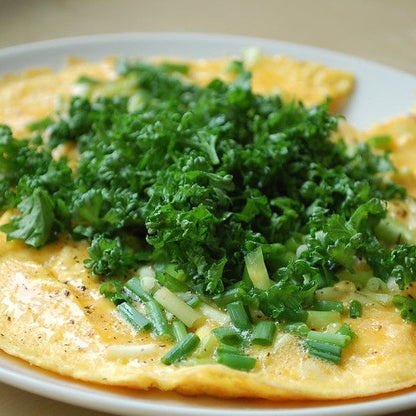 Forest green parsley on omelette, culinary herb.