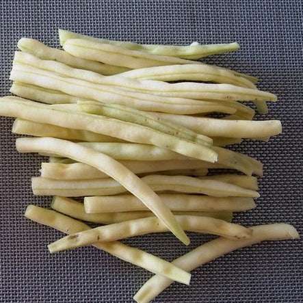 Wax Yellow Bush Beans  on display on a textured surface.